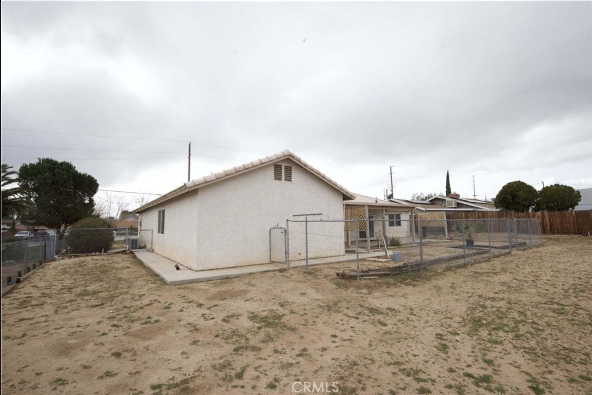 Real CRMLS listing photo of the home's exterior, watermark visible